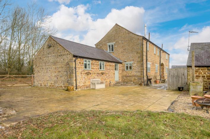 one acre including a secluded south facing garden running down to a stream.