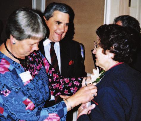 fund drive in April 1988. In April 1992, the Department of City and Regional Planning honored Shirley for her 33 years of work at UNC. Below, Jonathan Howes and his wife, Mary, congratulate Shirley.