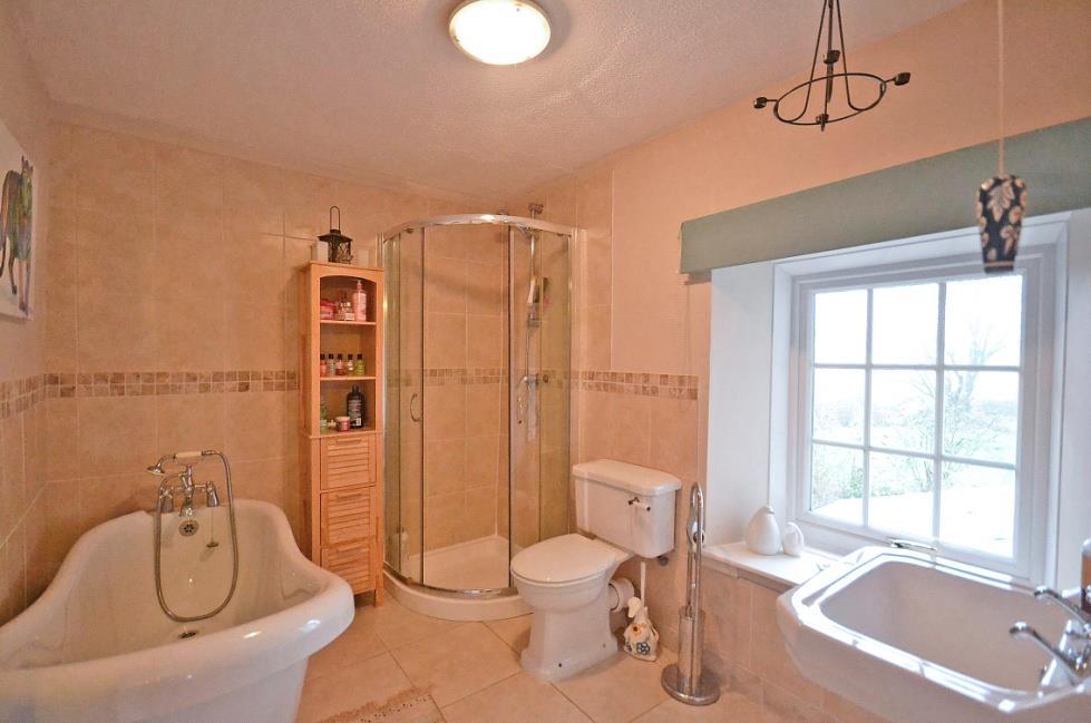 9 BATH / SHOWER ROOM 9 1 x 7 1. A contemporary take on period style including a claw footed roll edged slipper bath with chrome period style mixer tap and hand shower.