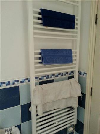 radiator. White heated towel radiator. Wall mounted.