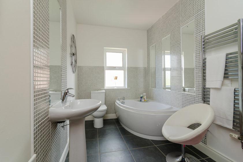 mosaic splash tiling, panelled shower cubicle, part tiled walls, tiled