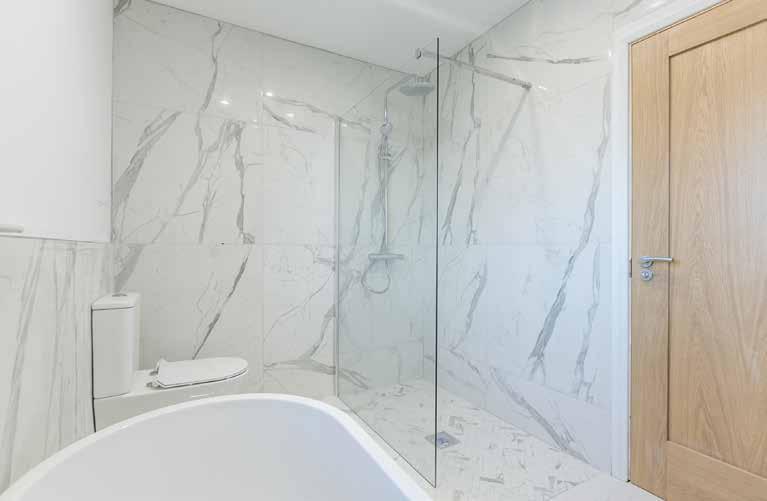 28m) LUXURY BATHROOM / WET ROOM: Luxury suite comprising of freestanding bath with mixer tap. Villeroy & Boch wash hand basin in vanity unit with illuminated mirror.