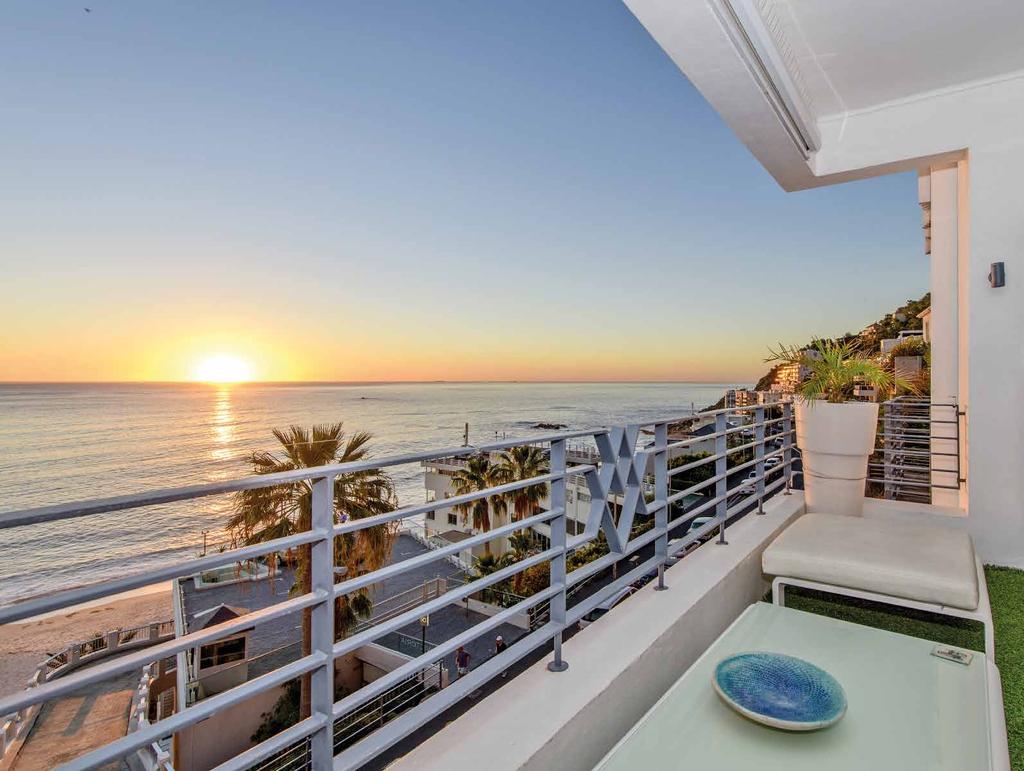 A stunning art deco penthouse set in the heart of the South African Riviera, with panoramic views over Cape Town s Atlantic coastline Entrance hall and foyer Open plan Reception room/ Dining room
