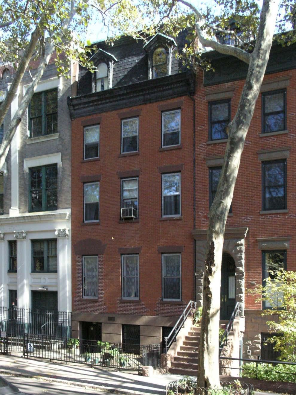 This Row House is a brick and wood structure that is 4-stories tall designed in the reminiscent styles of The Second Empire Style (1860-1975), which is similar to the Italianate Style that is also