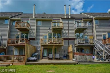 Updated appliances. Great views from the house & covered lake front porch/deck area. Wd burning fireplace with open liv/din area. Easy walk to water with shared type A dock. Located in quiet cove.