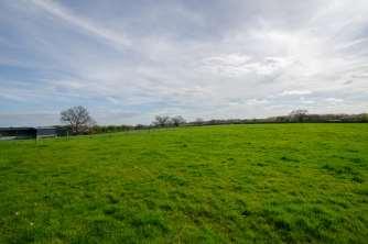 Immediately surrounding the gardens are a range of PADDOCKS & GRAZING LAND all boarded by mature hedging and stock proof post and rail fencing.