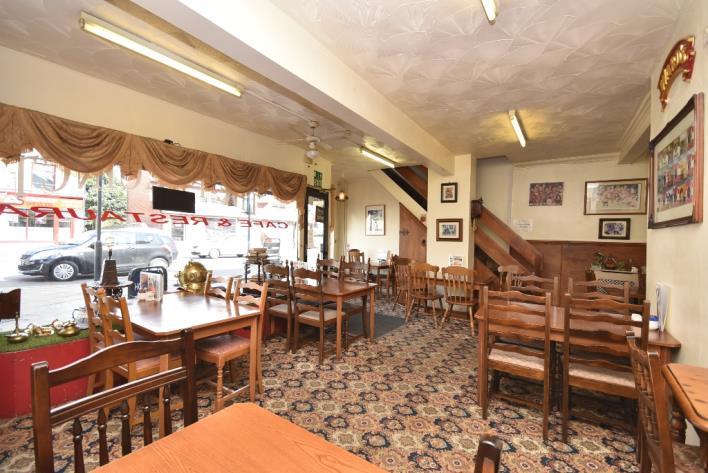 PROPERTY PARTICULARS Prominent freehold commercial property, profitable cafe / restaurant business and self-contained first floor flat, all located within the heart of Hemsworth Town Centre which are