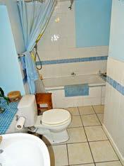 Family Bathroom With bath, shower, WC, WHB, window to the front.