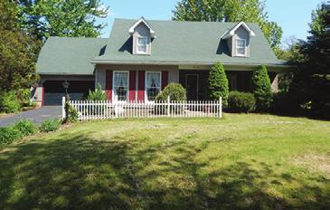 Large deck on the back of the main house perfect for enjoying the country setting! Two pear trees, one apple tree, and one peach tree on the property. 20 Oakfield Dr.