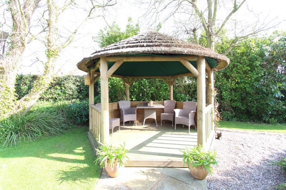 feature, with timber gazebo to one side and small