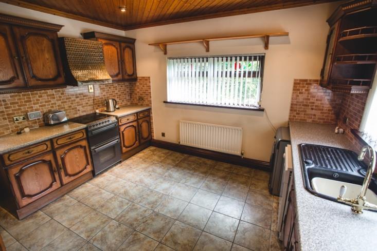 Good Kitchen: 12/9 x 11/6 with two separate windows. Part tiled walls around kitchen units and tiled flooring.