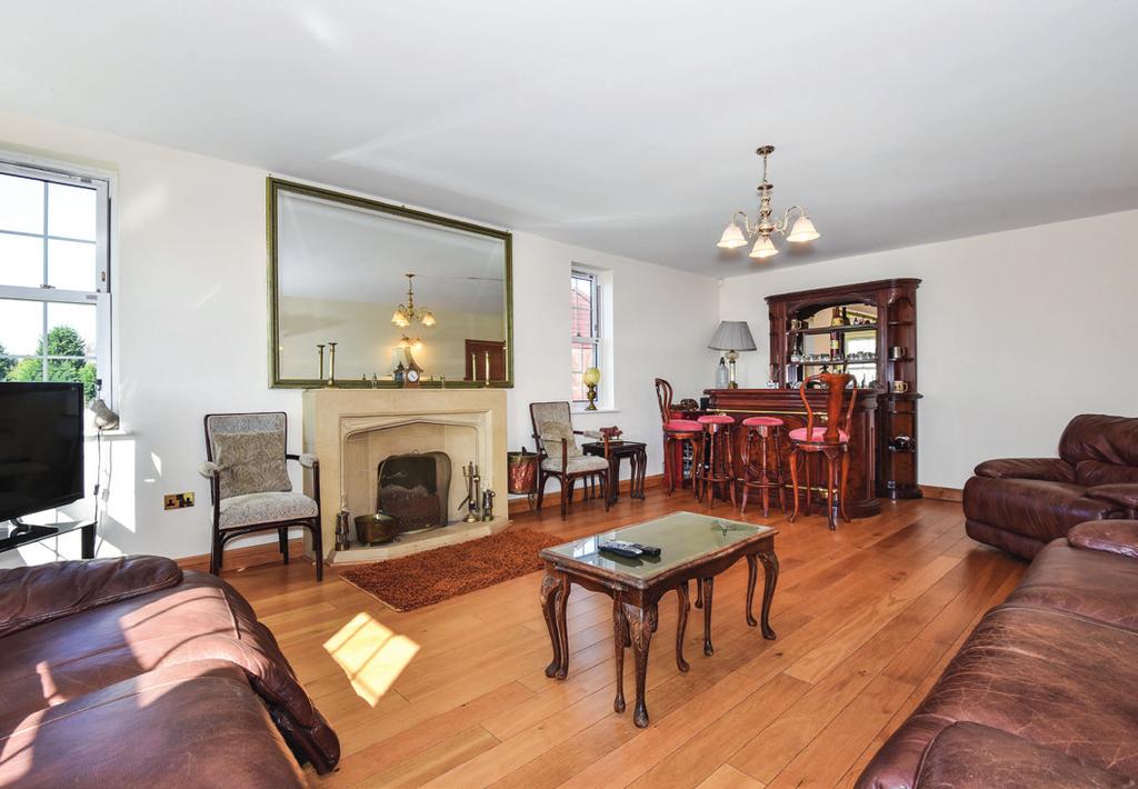 84m x 4.52m) Large double bedroom with two double glazed sash windows and wood flooring.