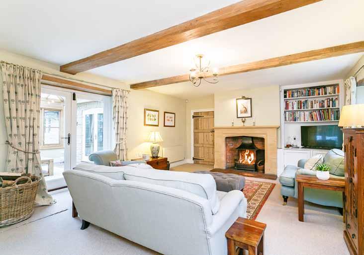 A beautiful Grade II listed home situated centrally within mature gardens.