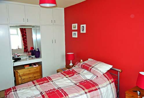 floor and wall units, electric oven and hob, two built-in cupboards (one housing hot water tank),