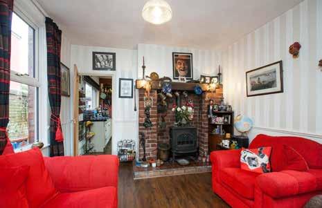 63m) (at widest points) Attractive painted wood fireplace with open fire, cast iron and tiled inset and tiled hearth. Cornice ceiling. Picture rail. upvc glazed double opening French doors to rear.