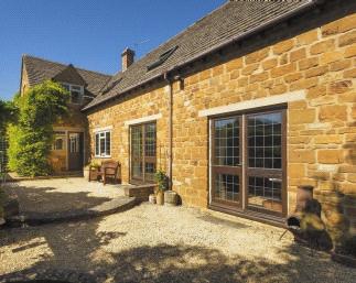 This Cotswold stone built property sits in an elevated and peaceful position, on the edge of the village, with wonderful views across open countryside and a stone entrance porch Drawing room having a