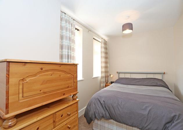 26m) This double sized room benefits from laminate flooring and has a window overlooking the rear of the
