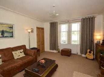 A double room with window out to open countryside views. There is carpet flooring, ceiling lighting and a radiator. sides and rear.