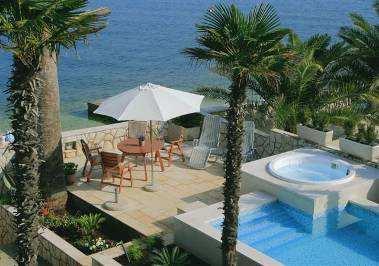 Palm Tree Villa has a superb position, right on the tranquil sea just wander down the stunning garden, through the arch and out onto the white pebbly beach.