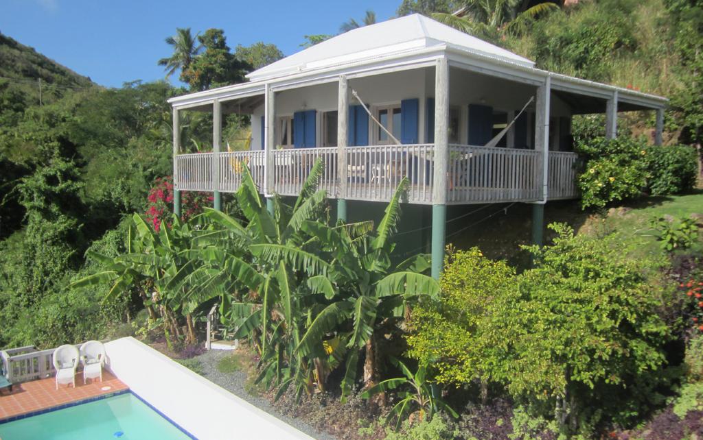 Dining on the Makere House deck Makere House with pool below Makere House open kitchen and living room The Property Makere House Makere Cottage Both villas have been built in the Caribbean Style with
