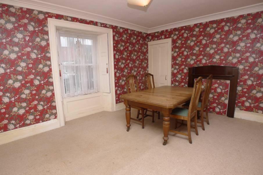 The drawing room has a dual aspect and has a multi fuel stove. The formal dining room has a period fire surround and is next to the dining kitchen with utility room off.