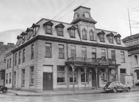By this time the building had been enlarged and converted into shops and warehouses. The property has historical or associative value related to its use as a hotel. After a fire, W. H.