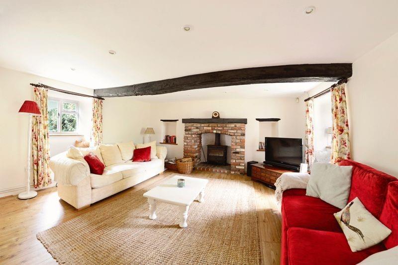 Offers in excess of 499,950 Description Crain s Cottage, which is not listed, is a pretty, detached period cottage of banded stone and flint construction under a thatched roof.