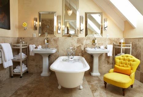 Bathe in style a stepdown bathroom features freestanding bath, elegant shower, antique Edwardian chair and two
