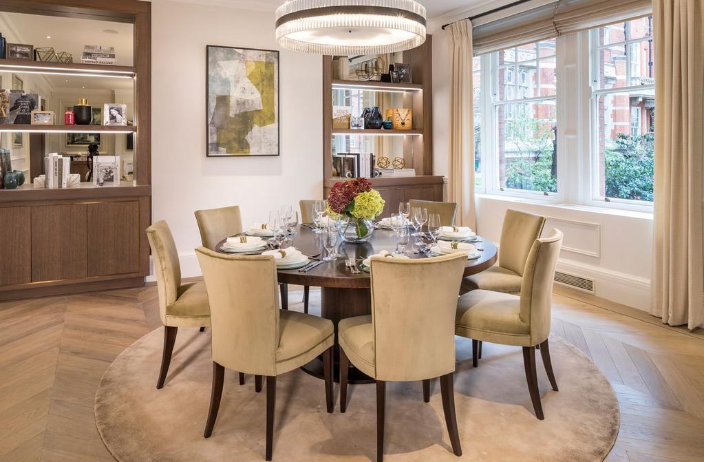 RECEPTION DINING AREA Featuring an oversized dining table with seating for eight, the intricately designed dining area harmoniously blends exquisite detailing with