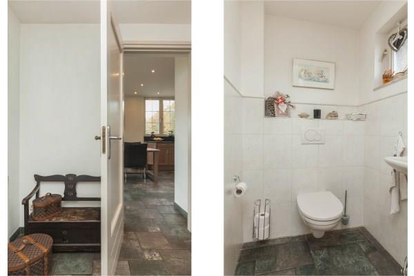 The toilet area has a wall-hung toilet, a small basin and natural ventilation. The toilet room is partly tiled with a stucco ceiling with recessed lighting.