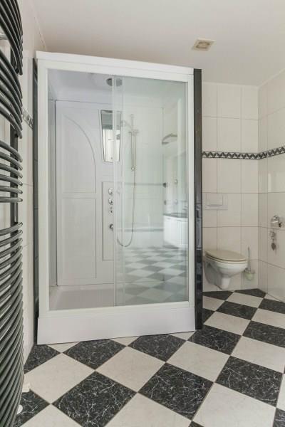 a separate shower, a double vanity unit, a wall-hung