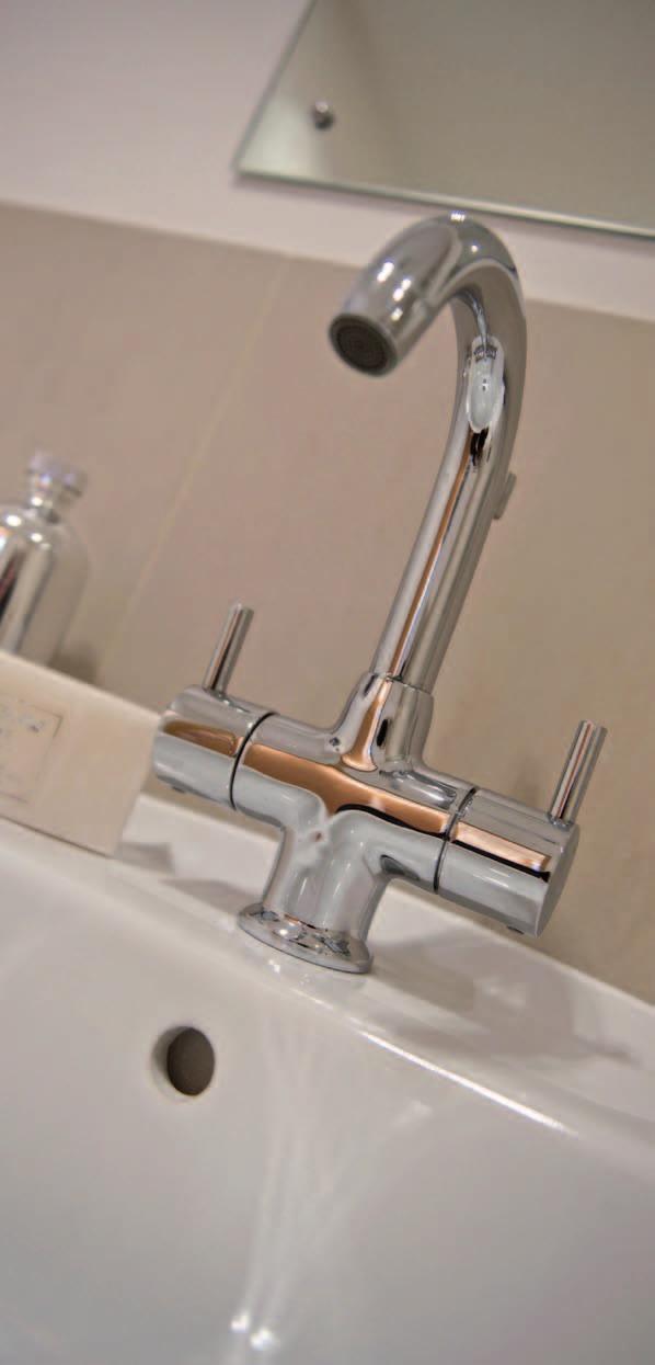 wall hung basin with contemporary chrome taps Co