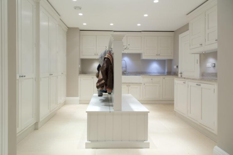 LIVING KITCHEN The magnificent living kitchen has a range of kitchen units by Mowlem and Co including one and a half bowl Kohler sink unit with mixer tap over and waste disposal beneath.