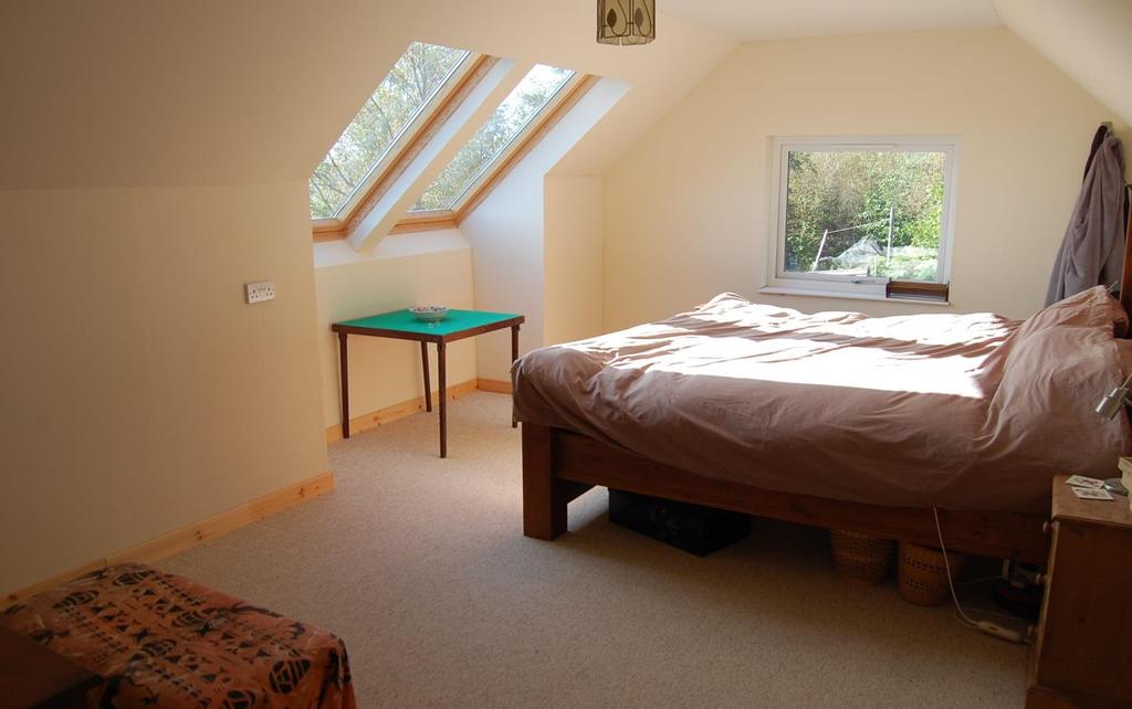 52 m The attic room is carpeted, has coombed ceilings and has three Velux windows to the front elevation, one to the rear elevation and has a double glazed window at each cable end.