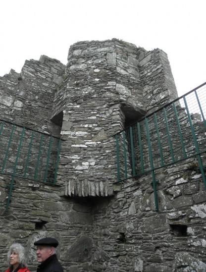Audley s Tower. The gatehouse type front arch machicolation looking down to the entrance. BELOW RIGHT: Through turret in the west corner.