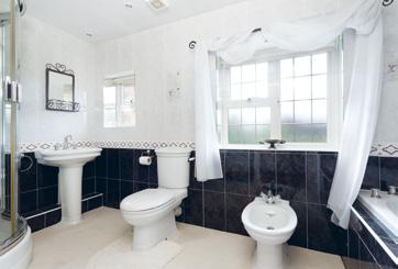 with en suite shower room, two further bedrooms and a family bathroom Gardens & grounds One approaches the property