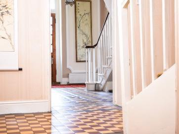 ACCOMMODATION COMPRISES:- MAIN GEORGIAN ENTRANCE HALL An attractive decorative tiled floor, elegant wall panelling and a ten foot high corniced ceiling.