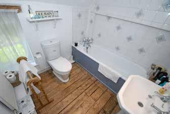 Bathrooms Family Bathroom Panelled bath with traditional style taps and hand shower attachment