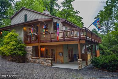 Featuring numerous amenities; 5 BR, 3 Bath, great room with a wall of windows, open floor plan, hickory floors & cabinets, breakfast bar, fireplace, loft and large deck. Perfect Location!