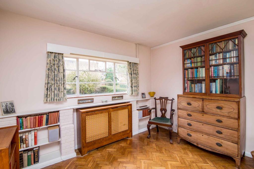 Study with fitted bookshelves and Dining Room with windows and French doors