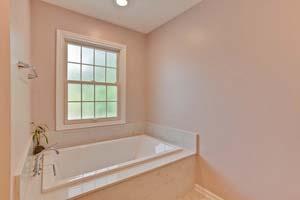 Master Bath Enjoy the ceramic tile shower with glass tile accents and