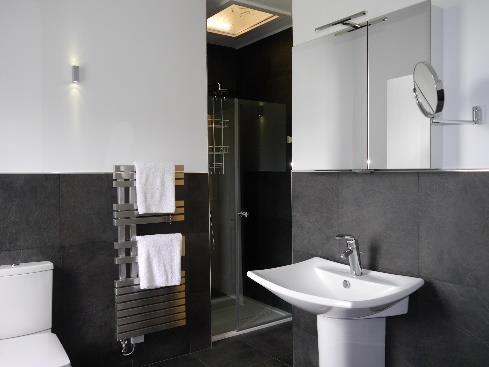 Bathroom: Heated underfloor Italian slate tile flooring,