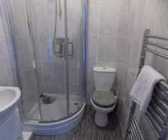 The white suite comprises a low flush W.C.