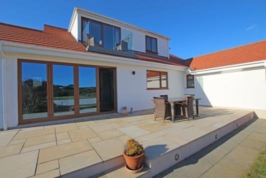 EXTERIOR The property is approached off the seafront over a mainly gravelled driveway shared with one other