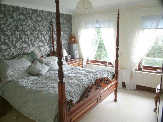 Bedroom 2 3.89m x 3.86m (12ft 9ins x 12ft 8ins) At front of house. Blinds. Curtain poles. Wall lights. Fitted carpet. Double radiator.