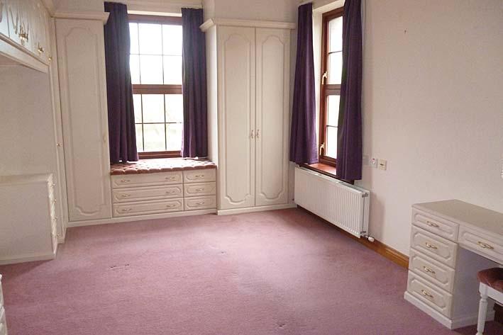 Cream curtains with wooden curtain poles. Fitted carpet. Large radiator. Ample power points. TV aerial.