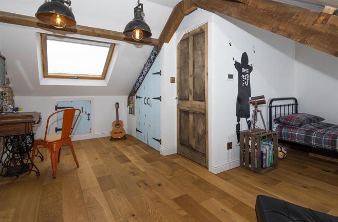 BEDROOM TO LOFT 4.80m (15' 9") (max) X 4.50m (14' 9") (max) Two Velux windows, full head height, solid wood flooring with underfloor heating, storage space to eaves, plastered and painted, T.
