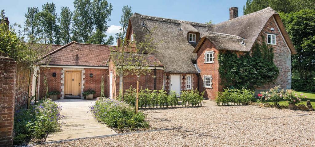 Secondary Accommodation, Outbuildings, Garden & Grounds The property is approached up a gravelled drive to a wide parking and turning area beside