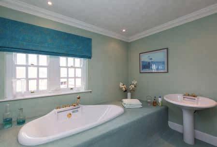 There are a further three double bedrooms with en suite shower rooms, a