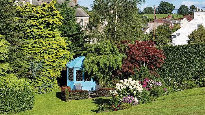 The large front garden is laid to lawn with steps down to a lovely Summerhouse positioned to catch the morning sun with paved seating area and attractive flower borders.